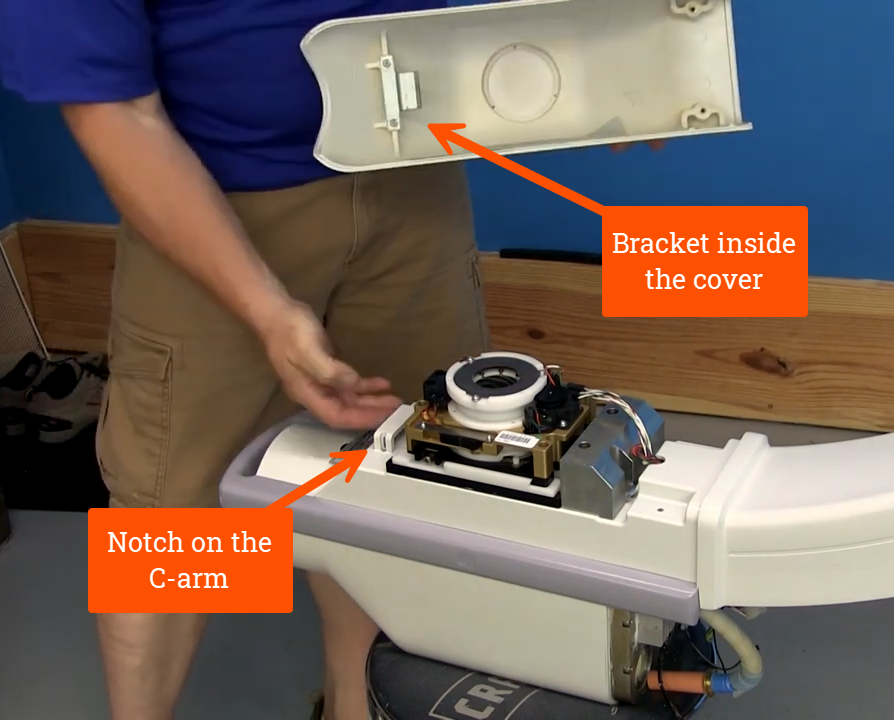 Bracket inside cover going underneath notch