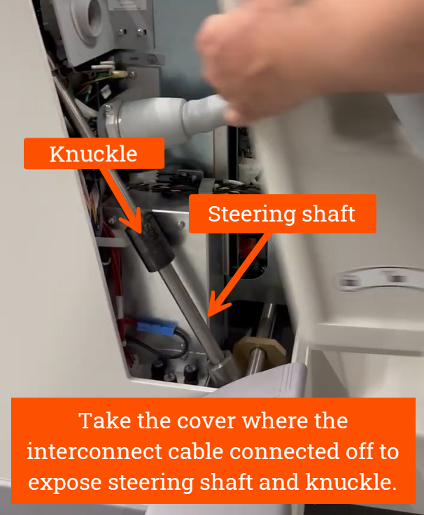 Take the cover where the interconnect cable connected off to expose steering shaft and knuckle