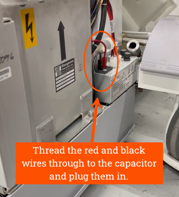 Thread the red and black wires through to the capacitor